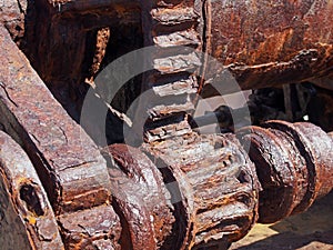 Rusted cogs and gears on an old broken industrial machine