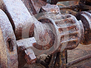 Rusted cogs and gears on an old broken industrial machine