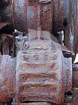 Rusted cogs and gears on an old broken industrial machine