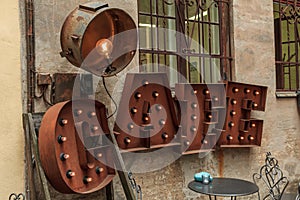 Rusted color word cafe with lights photo