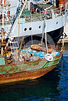 Rusted Commercial Ship and Modern Container Ship in Port