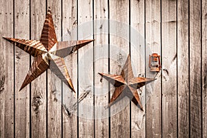 Rusted confederate stars on a barn door