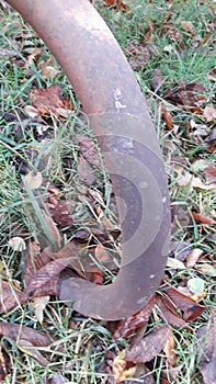 Rusted curved metal old weathered outdoor furniture wroughtiron wrought iron bent curve arch bent bend