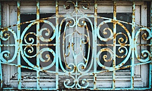 Rusted decorative iron window grate