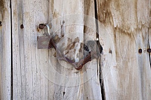 Rusted door lock on a traditional old turkish village gate