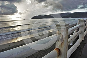 Rusted fence of beach esplanade