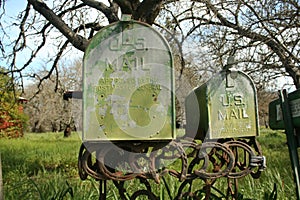 Rusted green mail boxes.