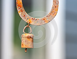 Rusted horseshow and rusted bell