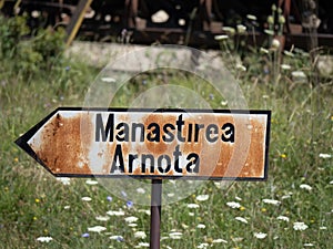 Rusted indicator to Arnota Monastery, Oltenia region, Romania
