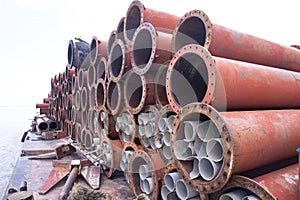 Rusted iron steel metal pipes stack an industrial field