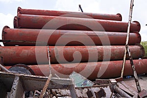 Rusted iron steel metal pipes stack an industrial field