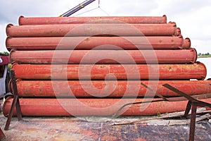 Rusted iron steel metal pipes stack an industrial field