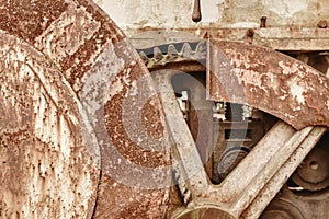 Rusted machinery detail in warm tone. Grunge