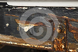 Rusted metal work on a boat hull