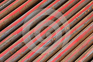 Rusted ms steel pipes diagonally arranged