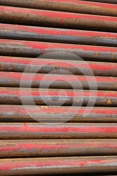 Rusted ms steel pipes diagonally arranged background