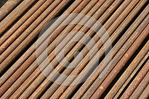 Rusted ms steel pipes diagonally arranged background