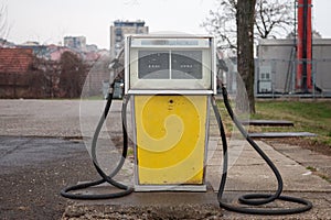 Rusted, old and abandoned gas dispenser in a former petrol station shot in the suburb of Belgrade, Serbia