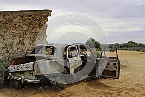 Rusted old car in the outback