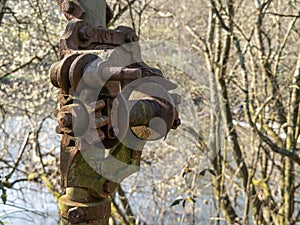 Rusted old hoist along river, canal near Torrington.