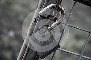 Rusted Old Lock on a Metal Chain.