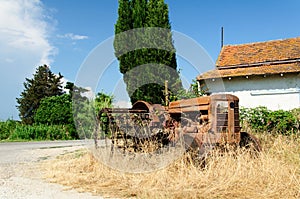 A rusted old tractor engine