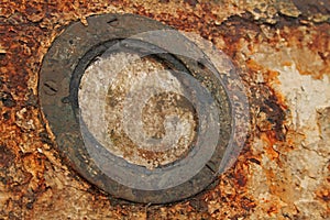 Rusted porthole on the ship