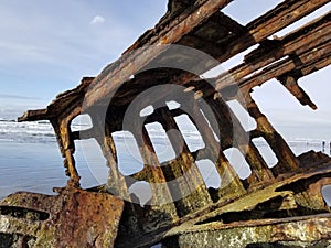 Rusted shipwreck on beach