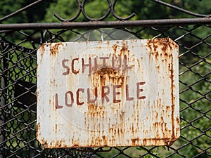 Rusted sign of Locurele Hermitage, Gorj County, Romania