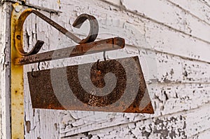 The rusted sign.