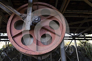 Rusted steel roller wheel abandoned industrial equipment from coal mining