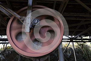 Rusted steel roller wheel abandoned industrial equipment from coal mining