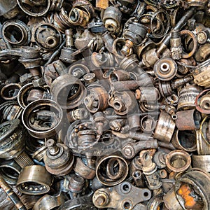 rusted steel scrap pile of used car parts and pieces