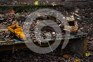 Rusted toy trucks in the kindergarten at the abandoned village Kopachi near Chernobyl