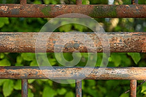Rusted tubular metal fence close up detail shot shallow depth of field