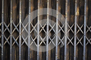 Rusted vintage folding old metal door gate background