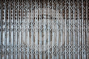 Rusted vintage folding old metal door gate background texture