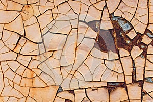 Rusted white painted metal wall. Rusty metal background with streaks of rust. Rust stains. The metal surface rusted