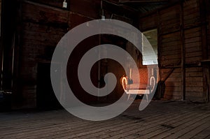 Rustic 1950's chair in a derelict farm building