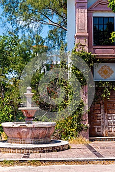Rustic abandoned Spanish style building and fountain