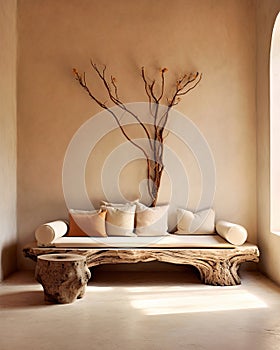 Rustic aged wood tree trunk bench with pillows near stucco wall with dried twig decor. Boho interior design of modern living room