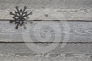 Rustic Background with Wood Texture and Wooden Snowflake in Upper Left Corner