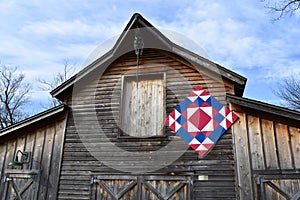 Rustic barn with Amish quilt