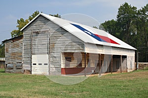 Rustic Barn in Rural East Texas With Texas Flag