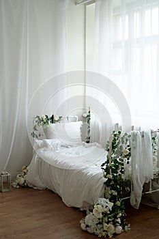 Rustic bed with flowers, white cotton linen. Metal Frame