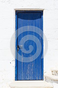 Rustic Blue Door on White Wall