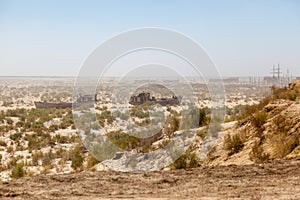 Rustic boats on a ship graveyards on a desert around Moynaq, Muynak or Moynoq - Aral sea or Aral lake - Uzbekistan in Central Asia