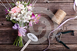 Rustic bouquet from gillyflowers and alstroemeria on old wooden