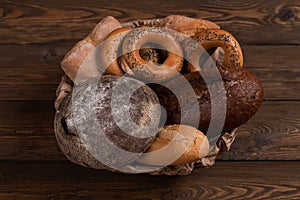 Rustic Bread In Bowl On Wooden Background Top View