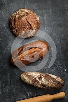 Rustic bread on dark background.